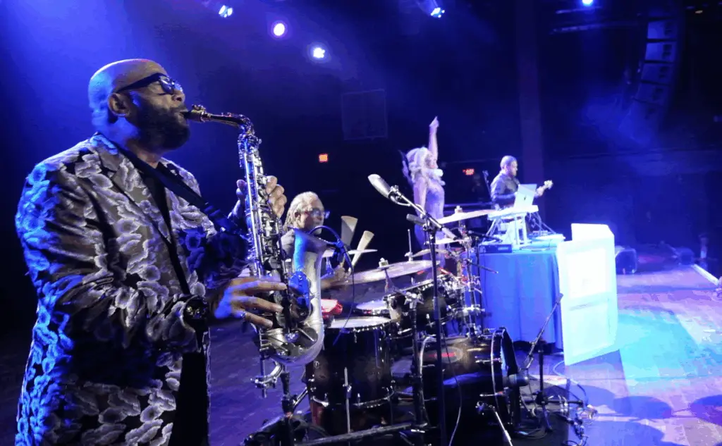 The ElectriX performing live at The Fillmore in Philadelphia with DeeJay Shelly on DJ decks, John “Sax” Williams on drums, and Paul on electric guitar.